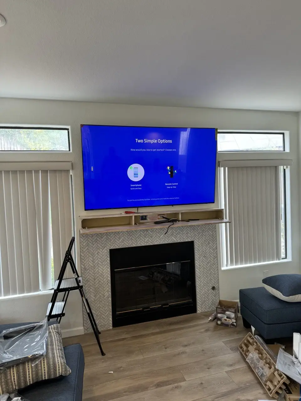 Large TV over fireplace in living room